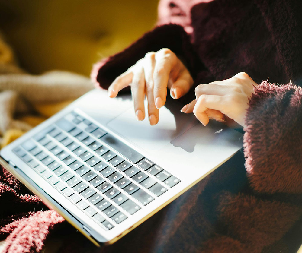 woman using a Mac laptop