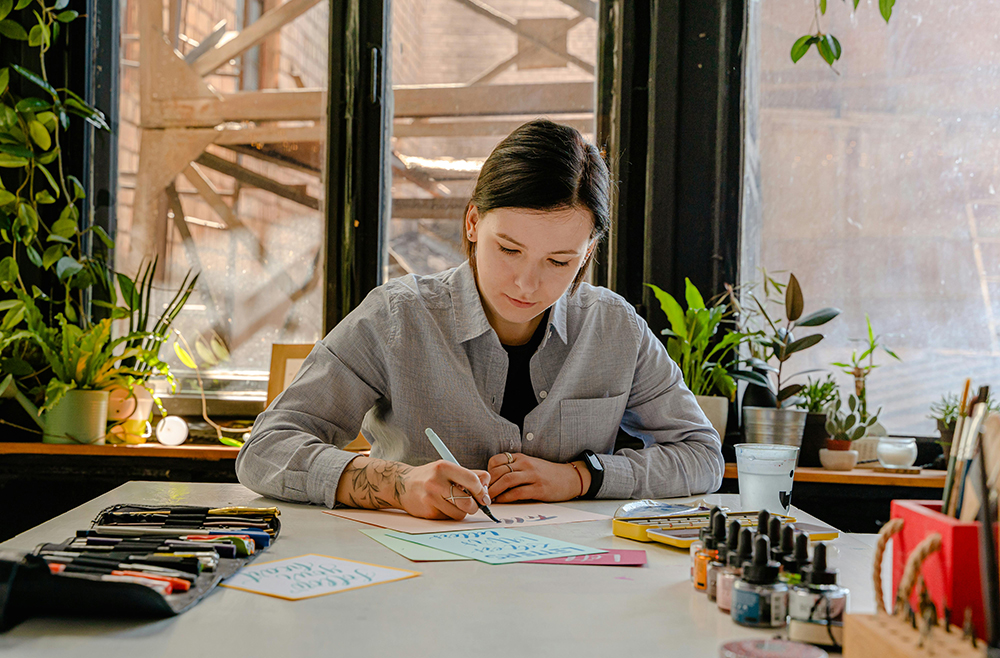 woman writing greeting cards